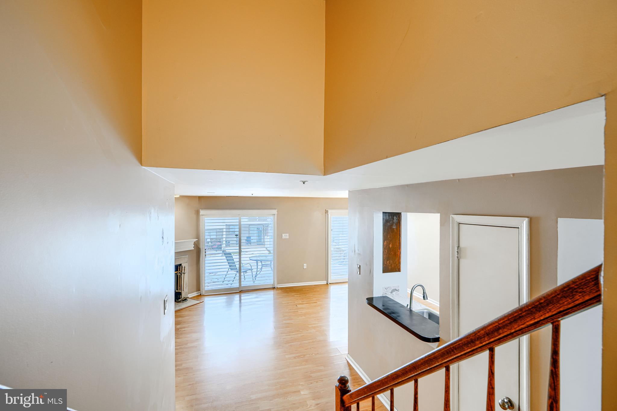 14235 Jib Street, Unit 7342 Laurel, MD 20707 - Photo 4 of 25 a view of a livingroom with wooden floor and stairs