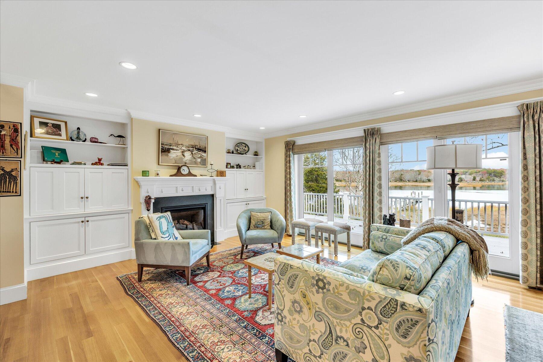 140 Summersea Road Mashpee, MA 02649 - Photo 14 of 39 a living room with furniture and a fireplace