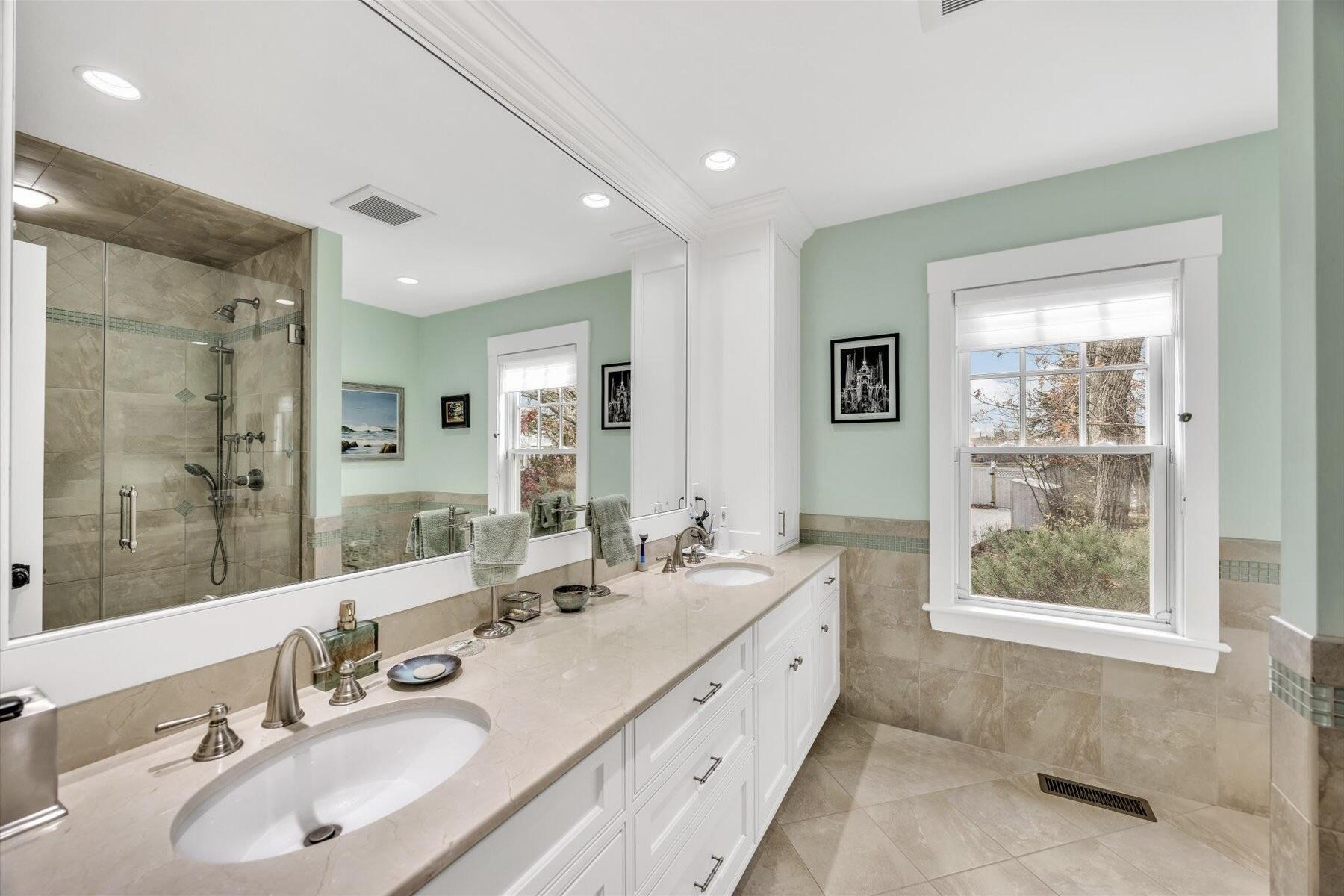 140 Summersea Road Mashpee, MA 02649 - Photo 17 of 39 a bathroom with double vanity sinks and a mirror