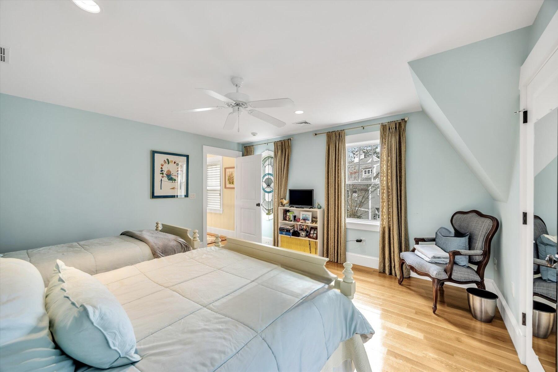 140 Summersea Road Mashpee, MA 02649 - Photo 20 of 39 a bedroom with a bed gym equipment and a large window