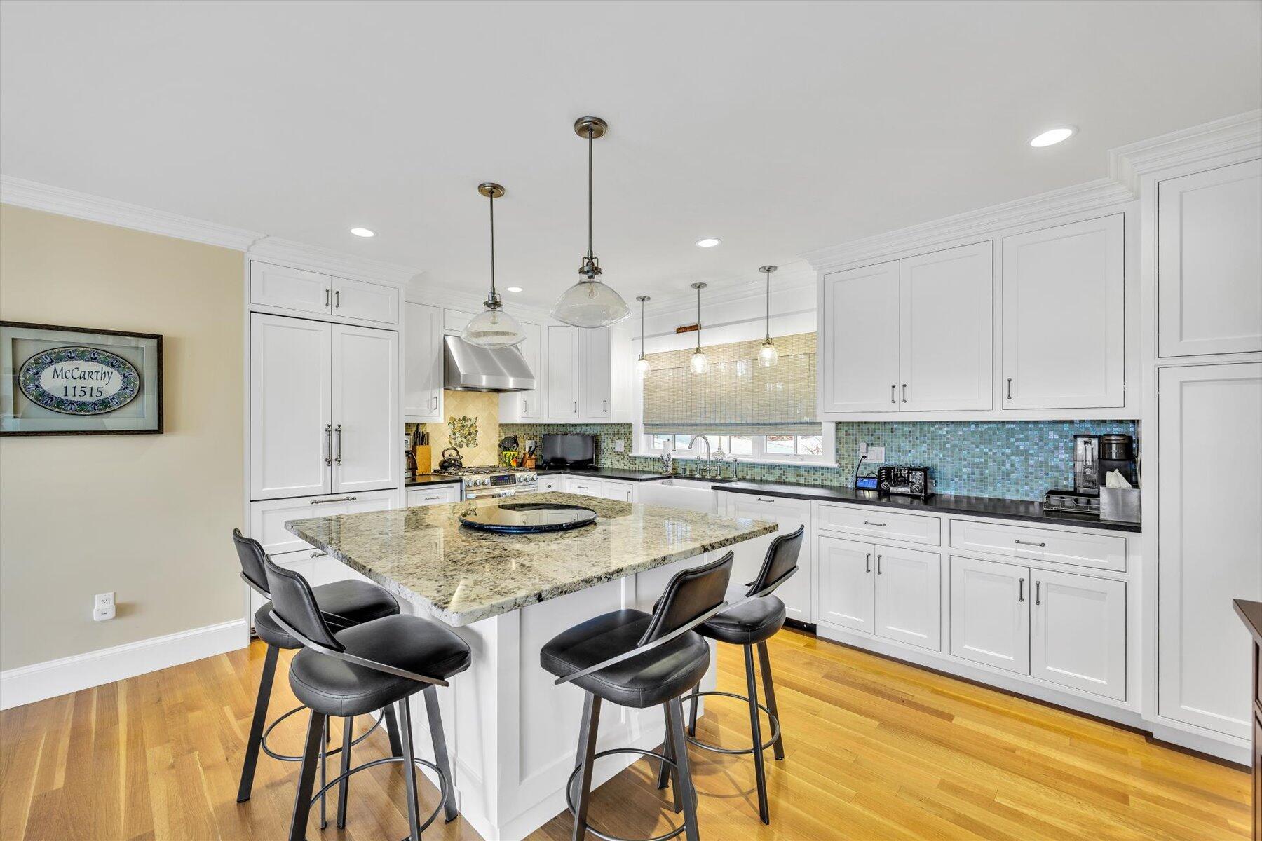 140 Summersea Road Mashpee, MA 02649 - Photo 10 of 39 a kitchen with stainless steel appliances kitchen island granite countertop a sink and cabinets