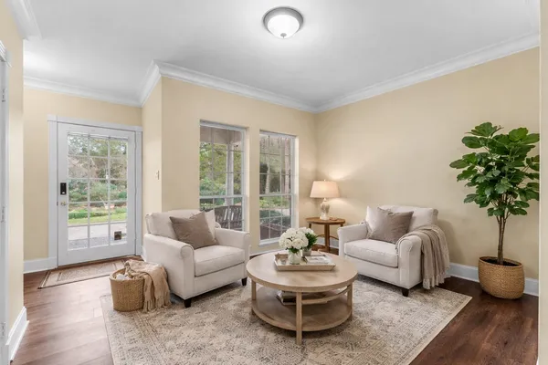 a living room with furniture and a large window with outer view