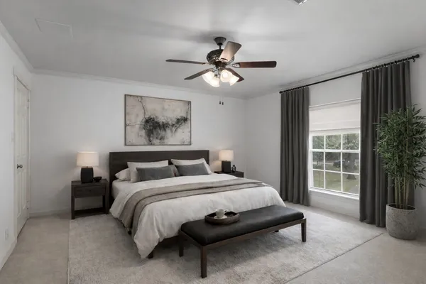 a bedroom with a bed painting and a large window