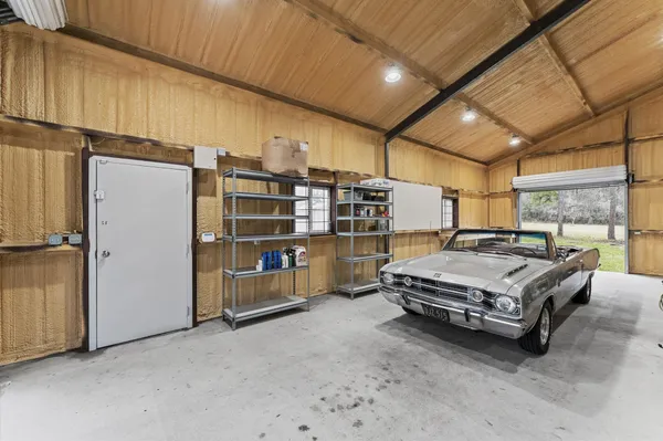 a green field with lots of trees