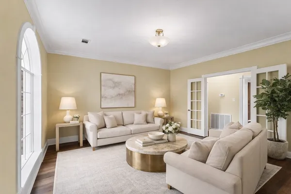 a living room with furniture and a large window