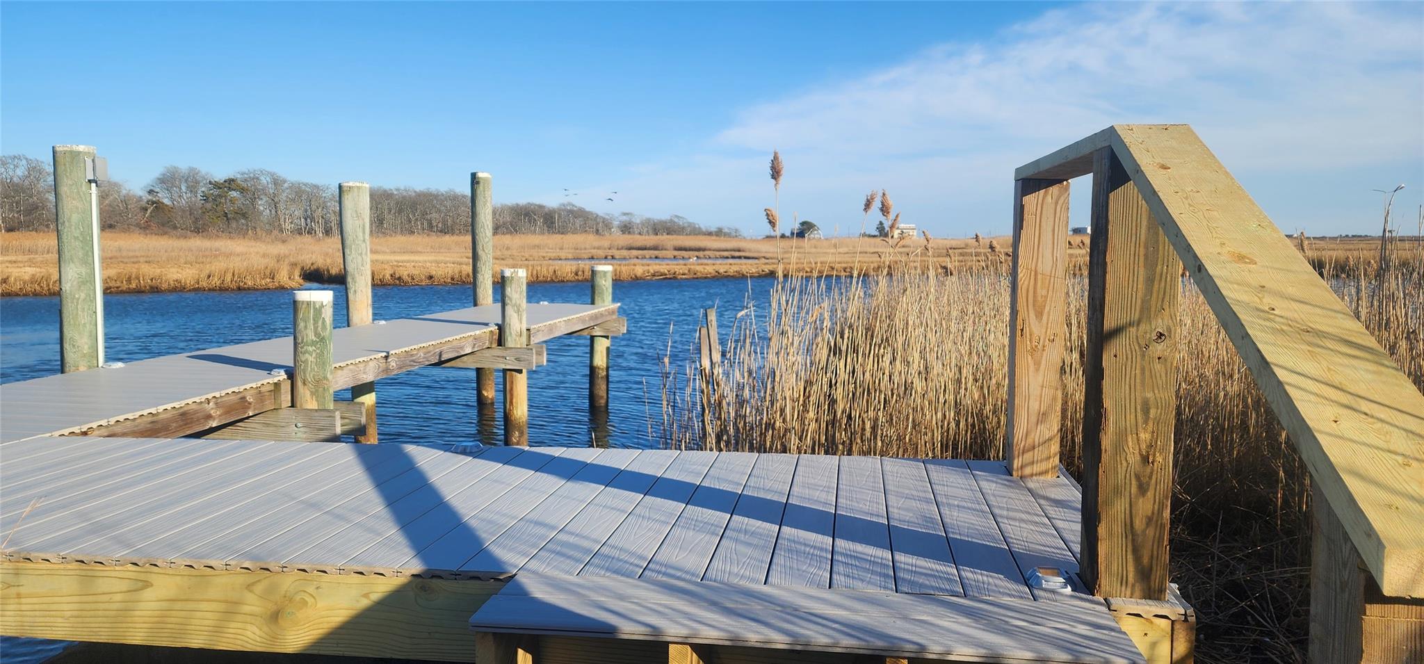 141 Johns Neck Road Shirley, NY 11967 - Photo 1 of 1 View of dock with a water view