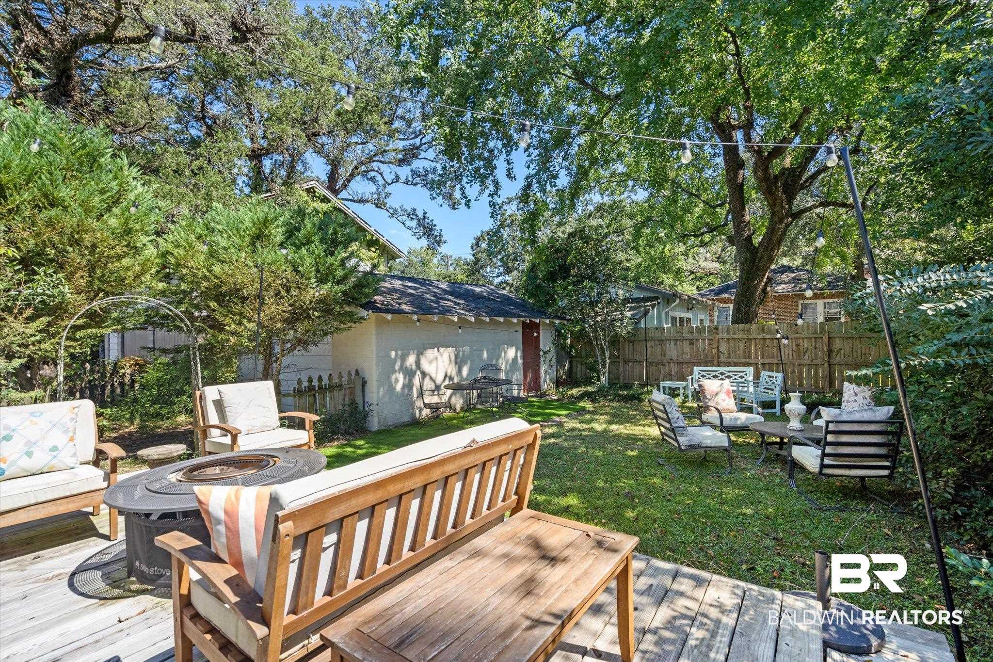 115 Bienville Avenue Mobile, AL 36606 - Photo 14 of 19 Deck with an outdoor living space with a fire pit and a lawn