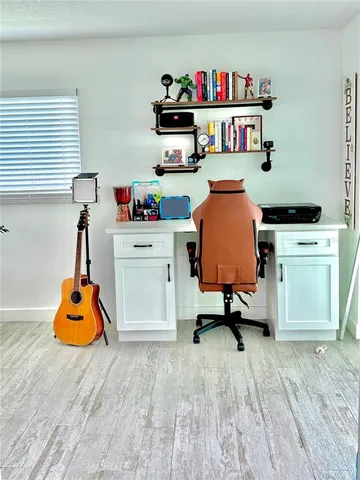 a bedroom with bed and a window