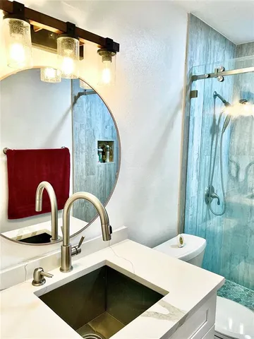 a bedroom with a bed window and dresser