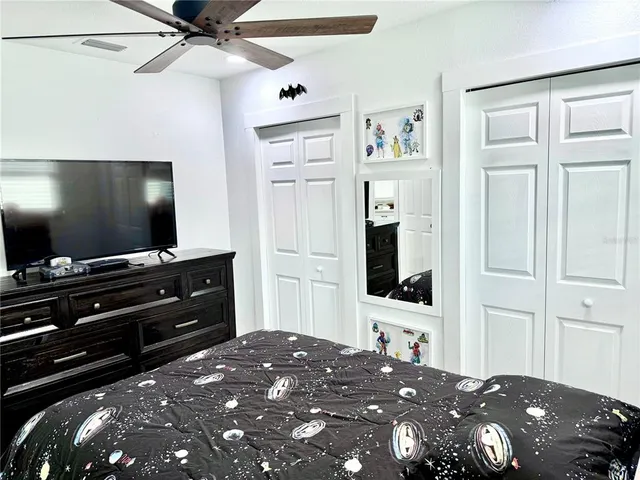 a view of a bathroom with a sink and mirror