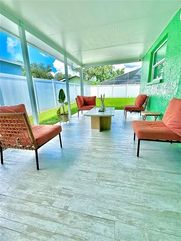 a view of an house with backyard space and garden