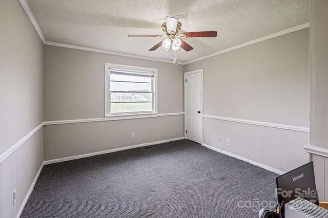 a view of a livingroom with furniture and a flat screen tv