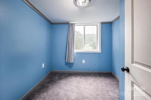 a bedroom with a bed and a chair