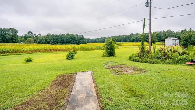 a view of a lake with houses in front of it