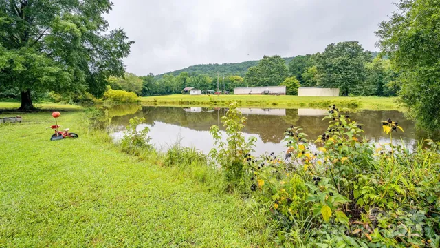 a front view of a house with a big yard