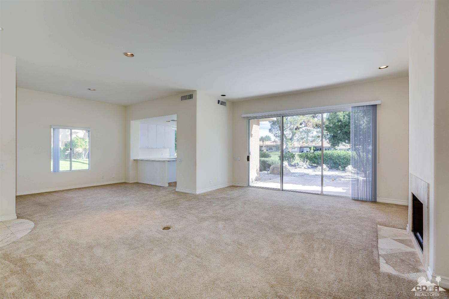 64 Oak Tree Drive Rancho Mirage, CA 92270 - Photo 12 of 31 a view of an empty room with a window