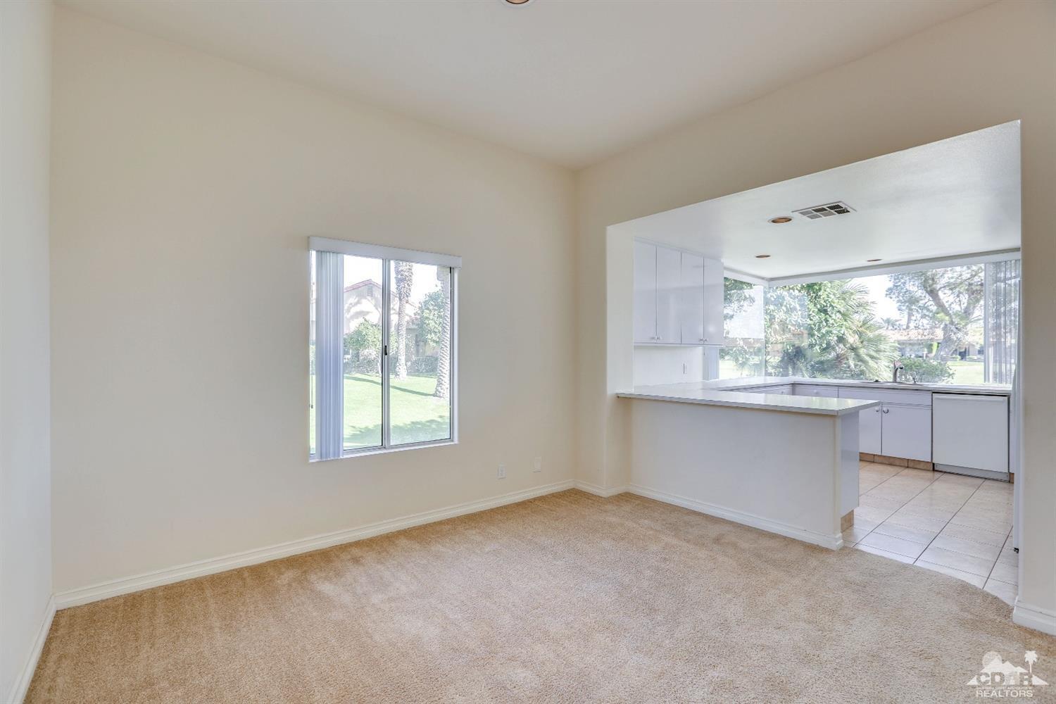 64 Oak Tree Drive Rancho Mirage, CA 92270 - Photo 14 of 31 an empty room with a window