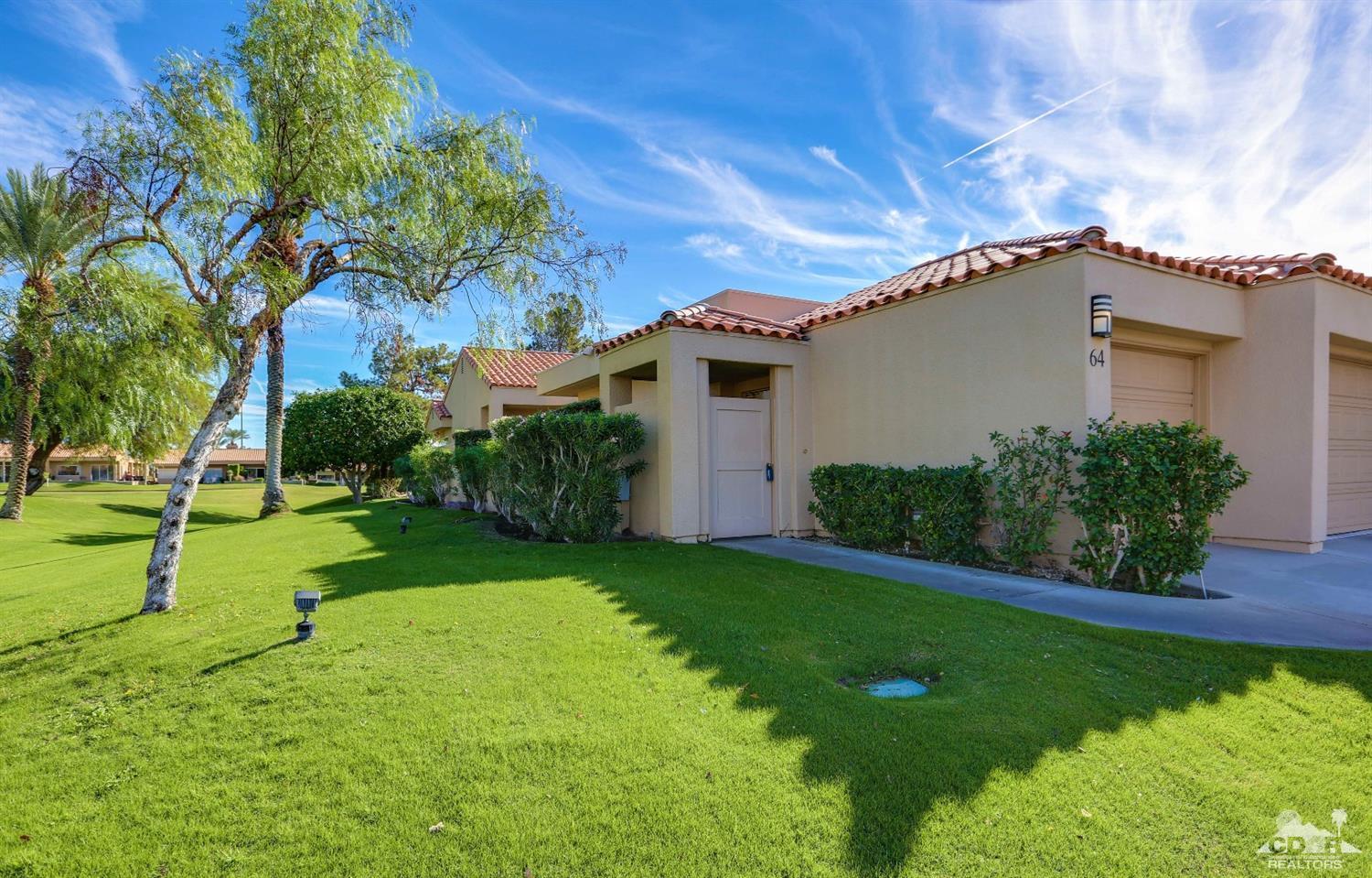 64 Oak Tree Drive Rancho Mirage, CA 92270 - Photo 3 of 31 a view of a house with a backyard