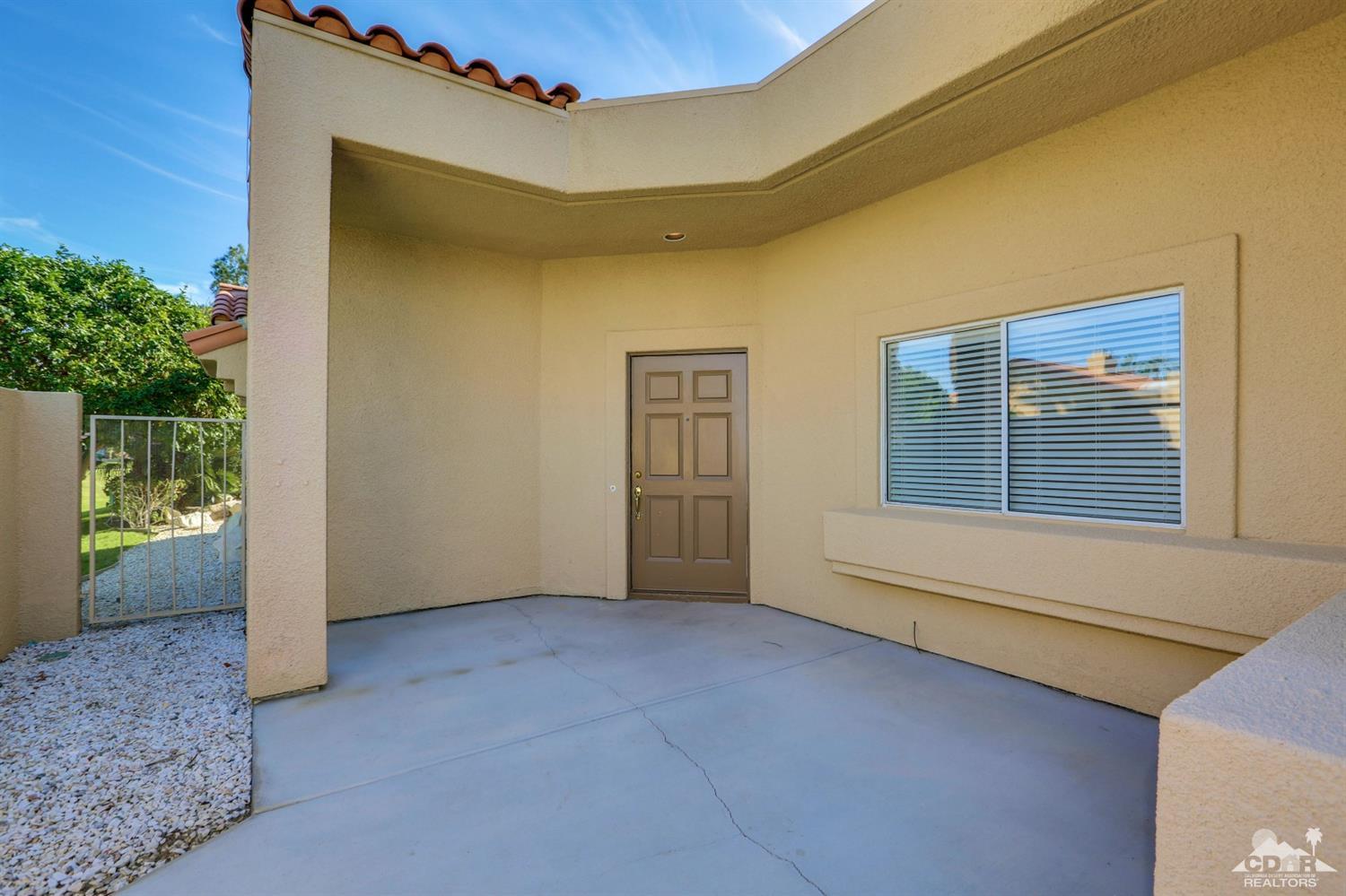 64 Oak Tree Drive Rancho Mirage, CA 92270 - Photo 6 of 31 a view of an empty room with a window