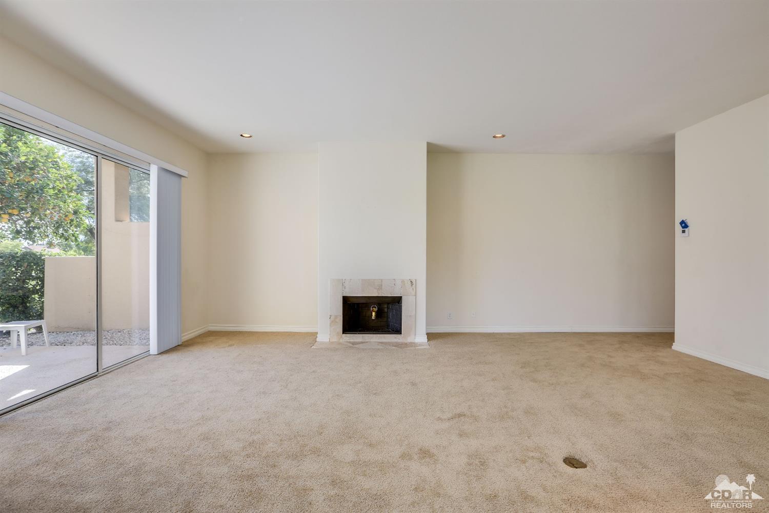 64 Oak Tree Drive Rancho Mirage, CA 92270 - Photo 10 of 31 a view of an empty room with a window
