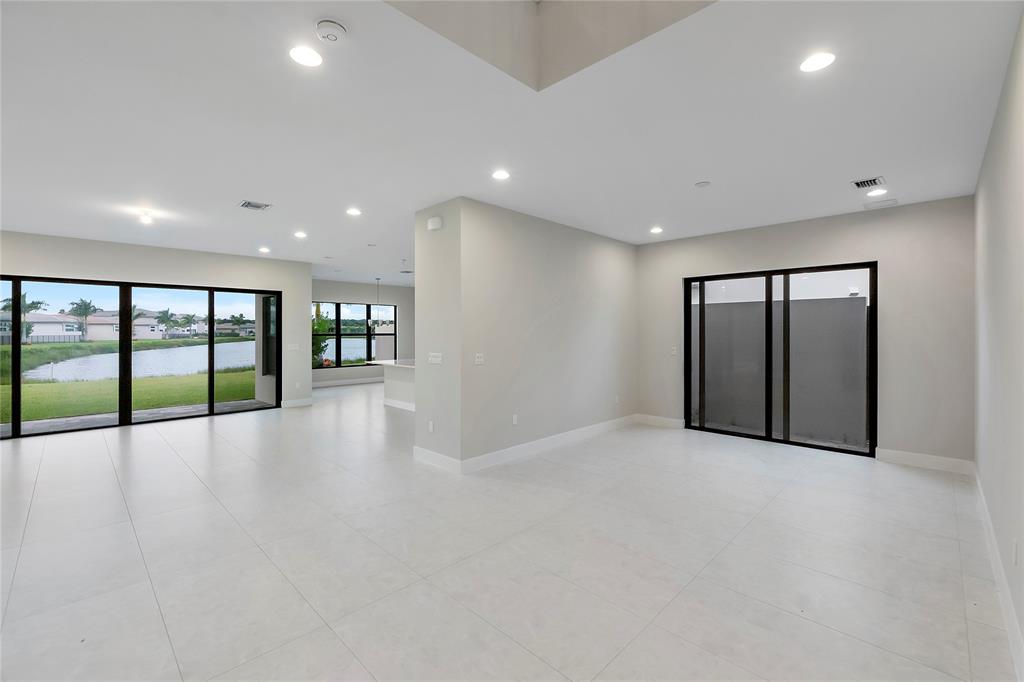 20119 Pacific Dunes Drive Boca Raton, FL 33434 - Photo 12 of 52 a view of an empty room with glass door