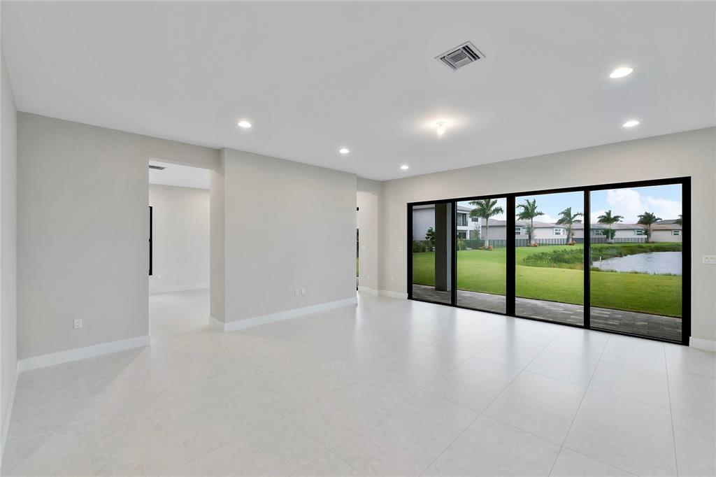 20119 Pacific Dunes Drive Boca Raton, FL 33434 - Photo 14 of 52 an empty room with large windows