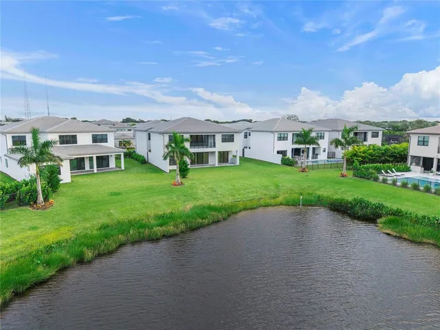 a front view of a house with a yard and a garage