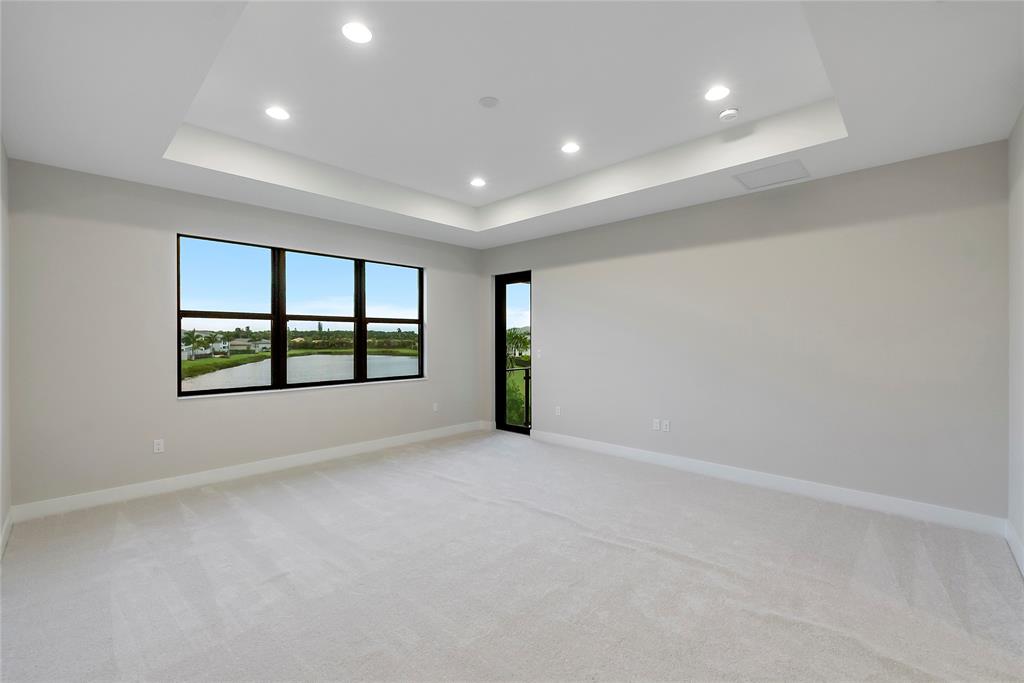 20119 Pacific Dunes Drive Boca Raton, FL 33434 - Photo 22 of 52 wooden floor in an empty room with a window