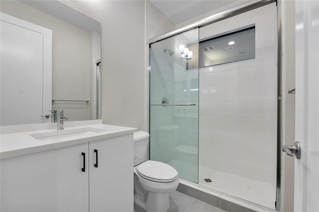 20119 Pacific Dunes Drive Boca Raton, FL 33434 - Photo 26 of 52 a bathroom with a sink toilet and shower