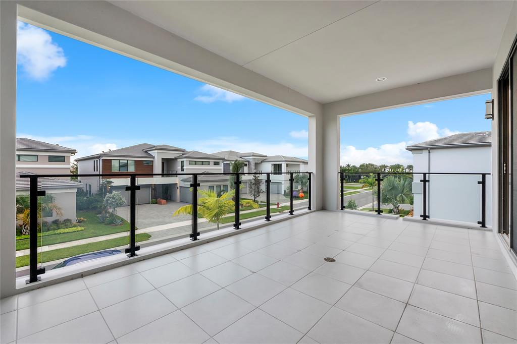 20119 Pacific Dunes Drive Boca Raton, FL 33434 - Photo 27 of 52 a view of an empty room with glass door and balcony