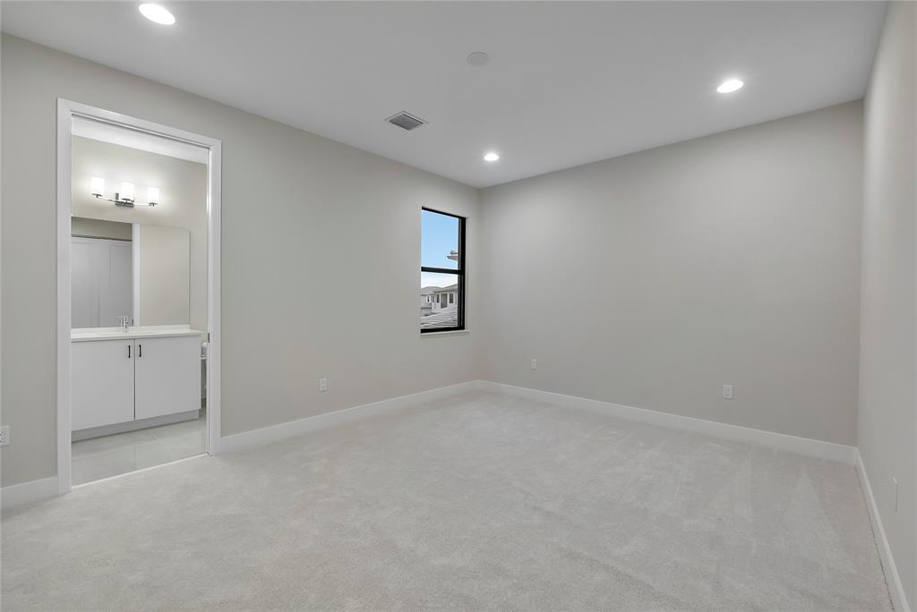 20119 Pacific Dunes Drive Boca Raton, FL 33434 - Photo 28 of 52 an empty room with windows and bathroom view