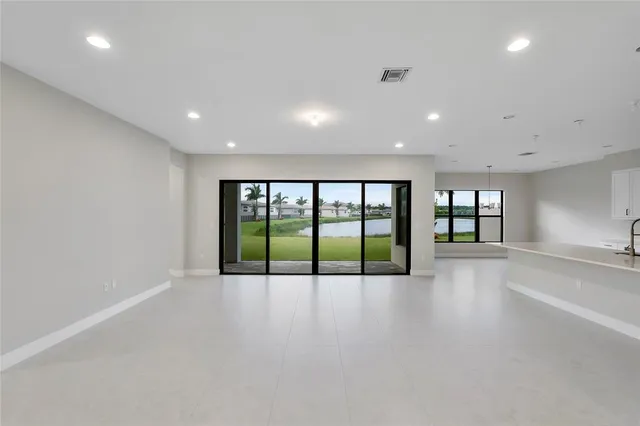 a bathroom with a shower sink and mirror