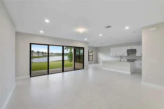 a bathroom with a shower sink vanity and toilet