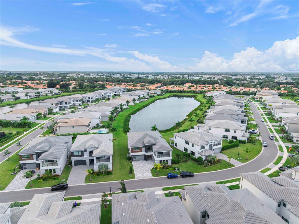 20119 Pacific Dunes Drive Boca Raton, FL 33434 - Photo 3 of 52 an aerial view of a city with lots of residential buildings