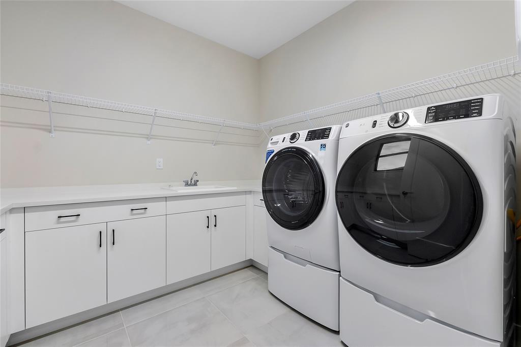 20119 Pacific Dunes Drive Boca Raton, FL 33434 - Photo 31 of 52 a utility room with dryer and washer
