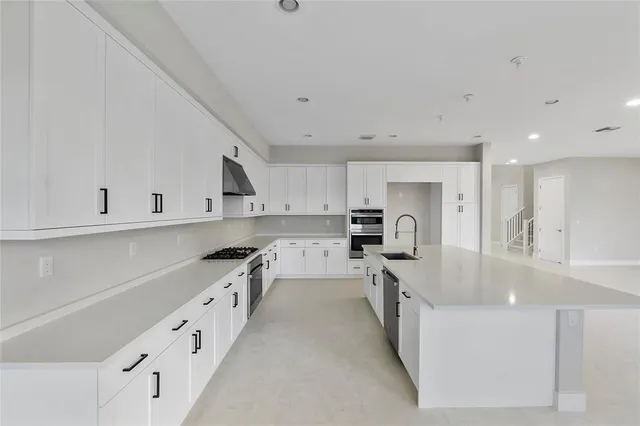 a view of an empty room with glass door and balcony