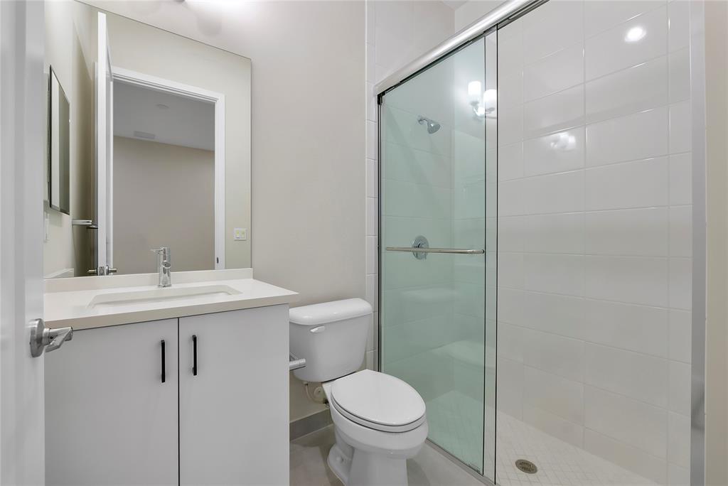 20119 Pacific Dunes Drive Boca Raton, FL 33434 - Photo 34 of 52 a bathroom with a sink toilet and shower