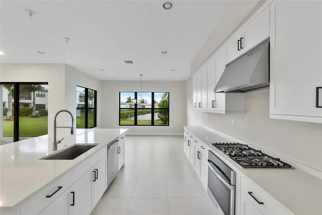 a bathroom with a toilet a sink a mirror and a bathtub