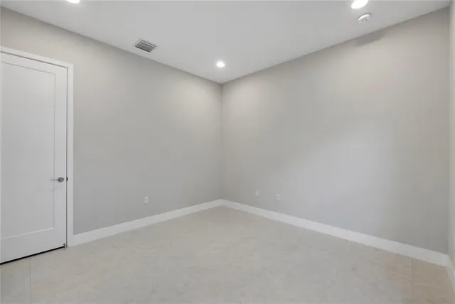 a view of a garden with a building in the background