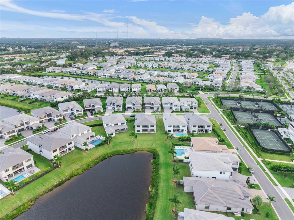 20119 Pacific Dunes Drive Boca Raton, FL 33434 - Photo 5 of 52 an aerial view of a city with lots of residential buildings ocean and mountain view in back