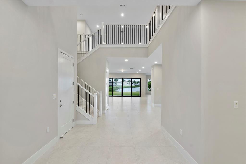 20119 Pacific Dunes Drive Boca Raton, FL 33434 - Photo 10 of 52 a view of an entryway with a hallway