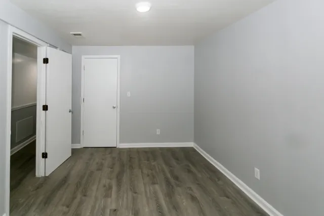 a view of wooden floor in an empty room