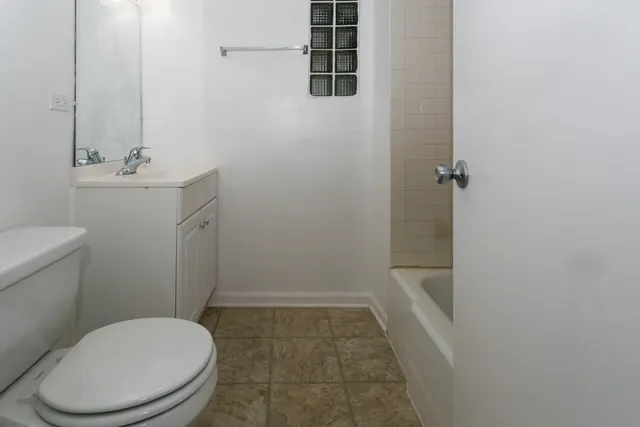 a bathroom with a toilet and a sink