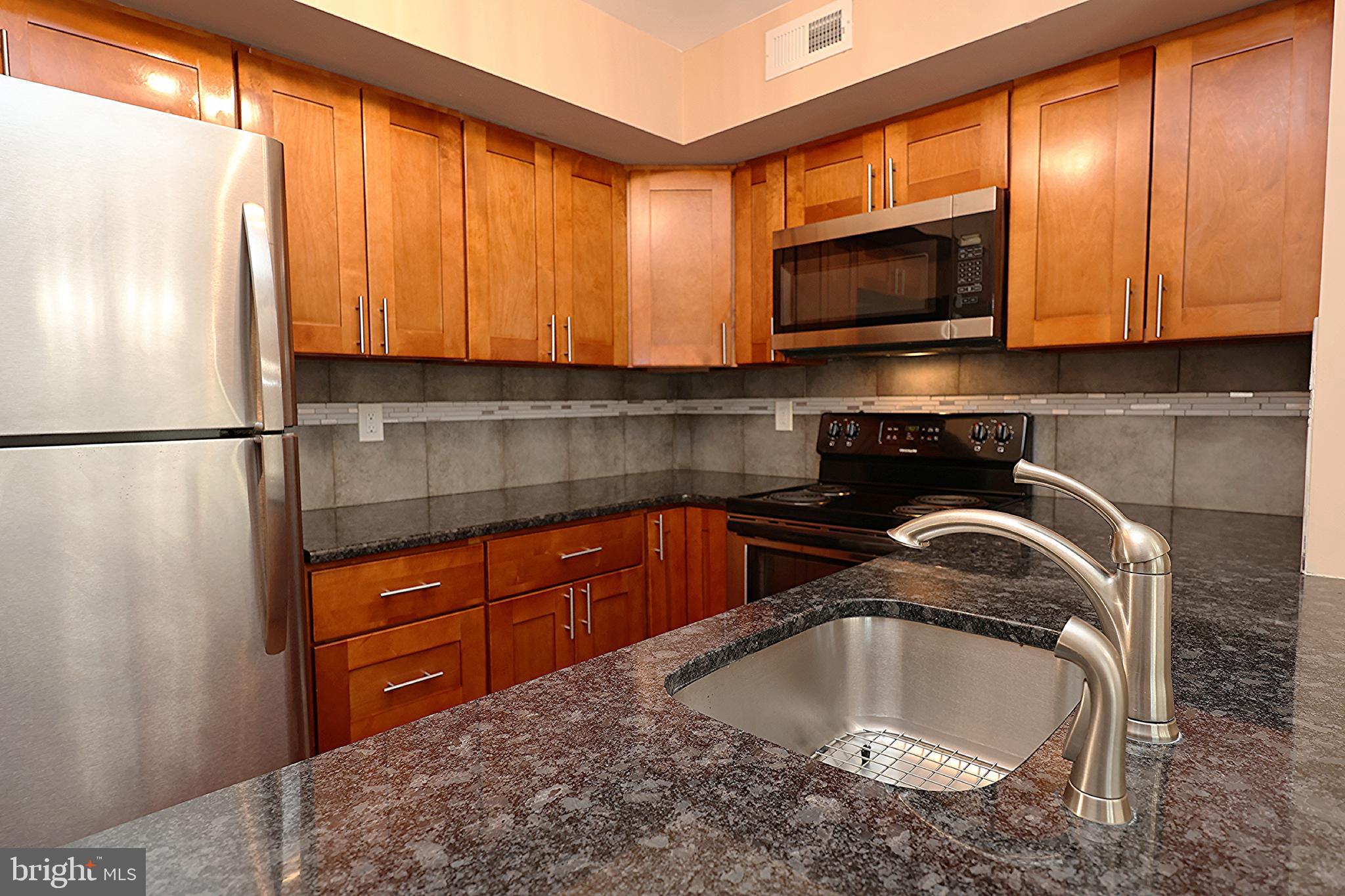 13 Five Crown Royal Marlton, NJ 08053 - Photo 13 of 31 a kitchen with a sink a microwave and cabinets