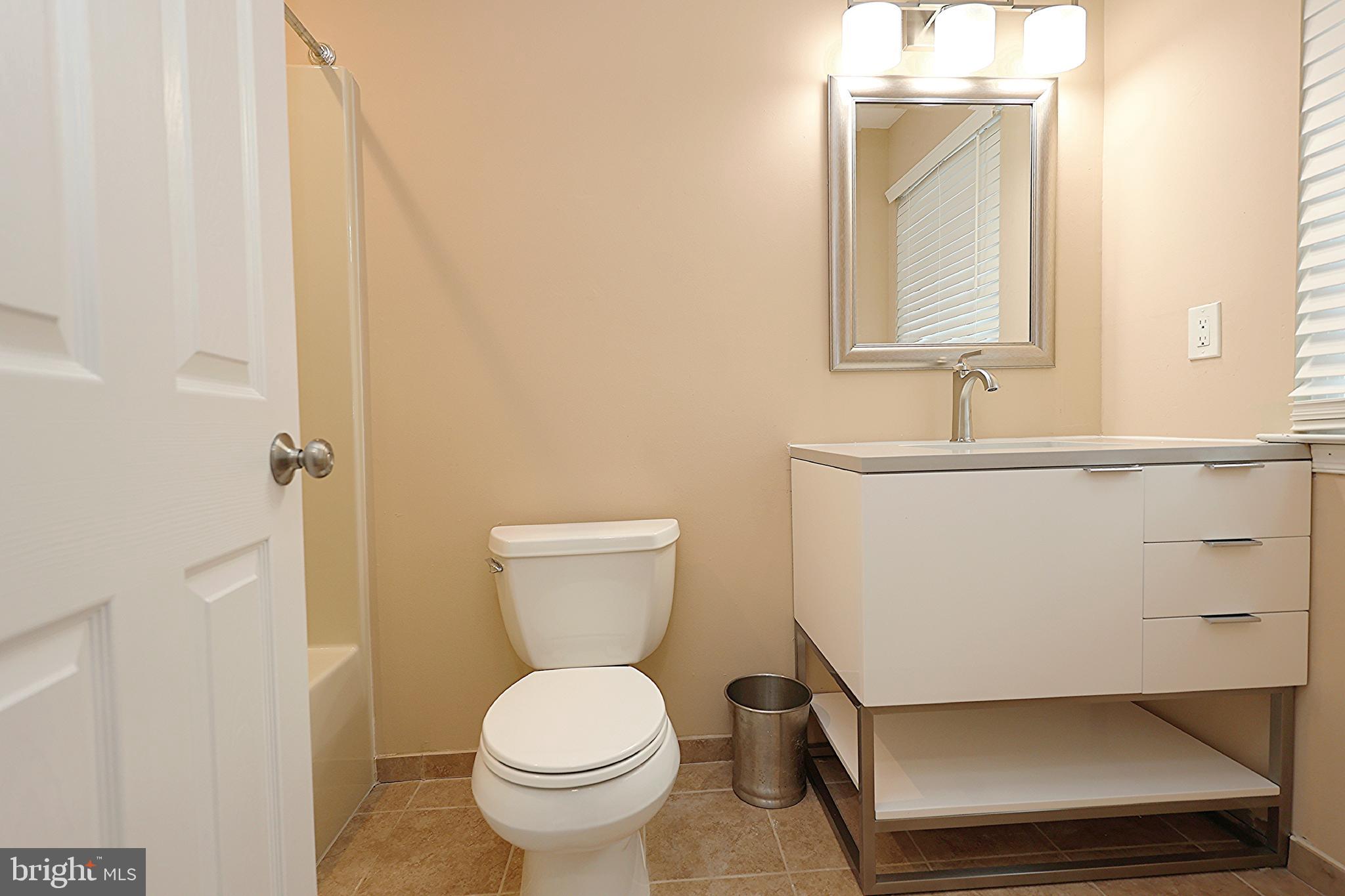 13 Five Crown Royal Marlton, NJ 08053 - Photo 23 of 31 a bathroom with a toilet sink and mirror