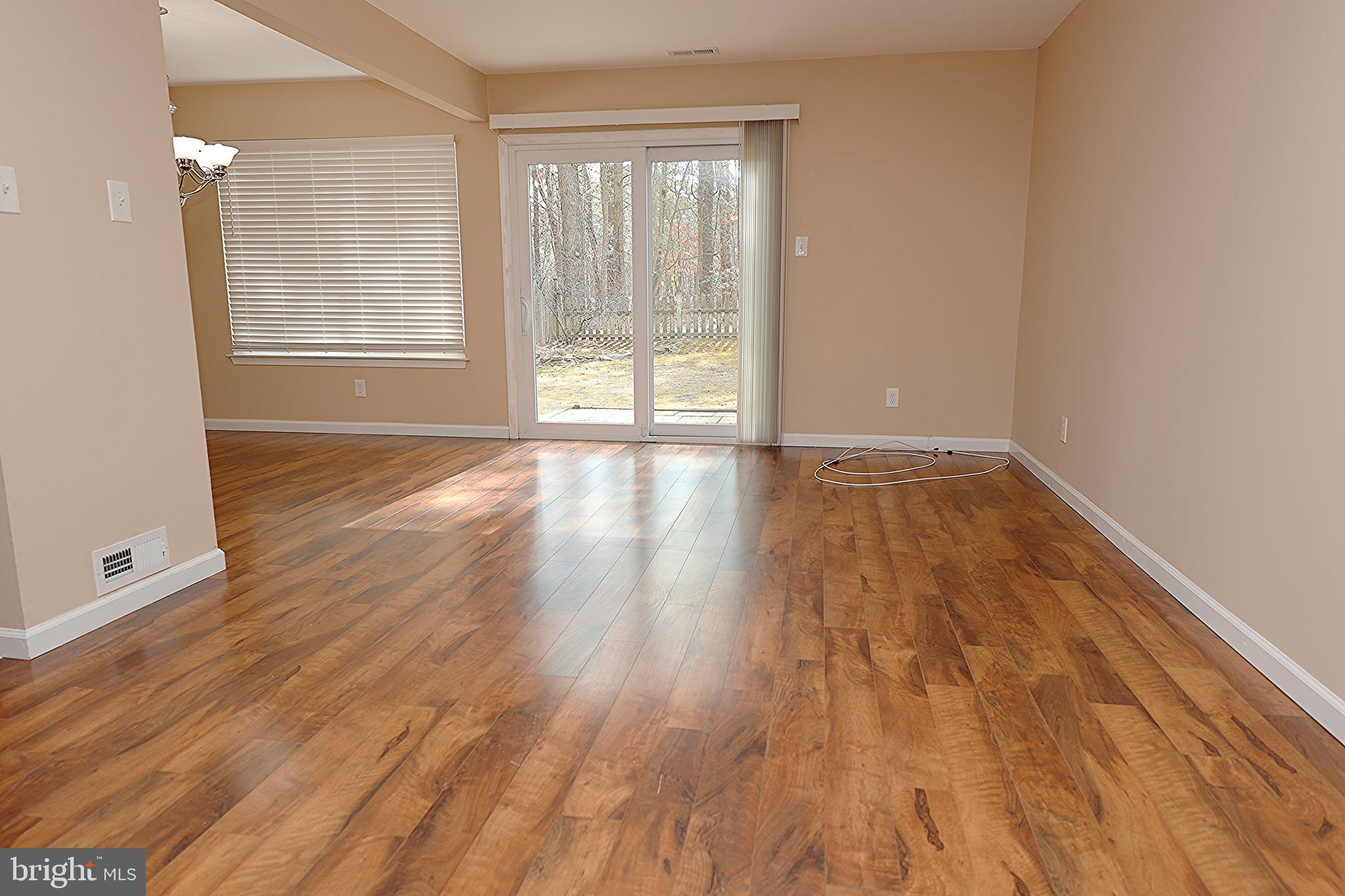 13 Five Crown Royal Marlton, NJ 08053 - Photo 6 of 31 a view of an empty room with wooden floor and a window