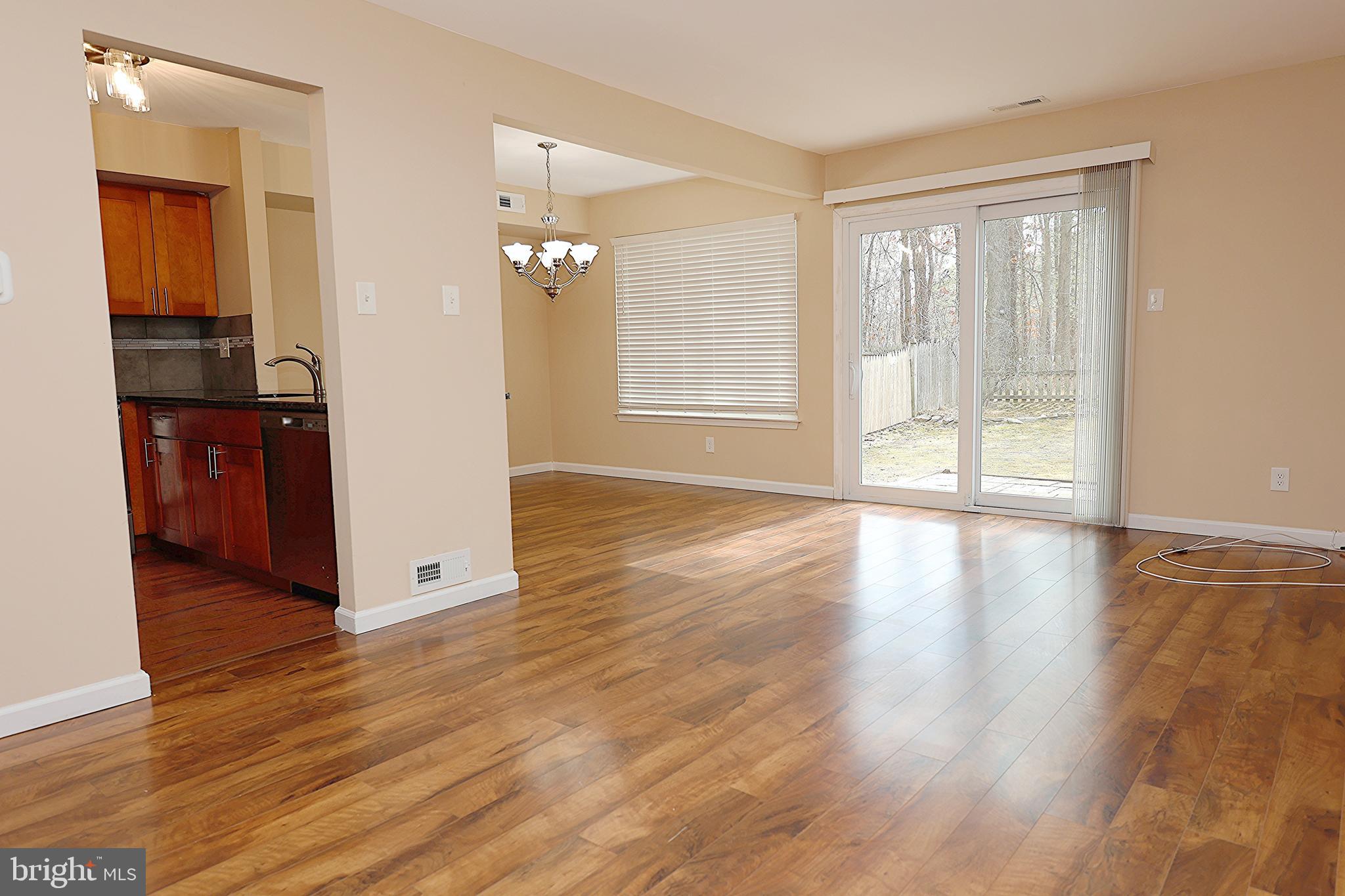13 Five Crown Royal Marlton, NJ 08053 - Photo 8 of 31 a view of an empty room with wooden floor and a window