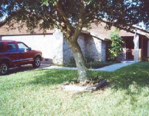 a view of a two chairs in a yard