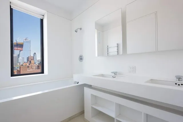 a bathroom with a bathtub and a sink