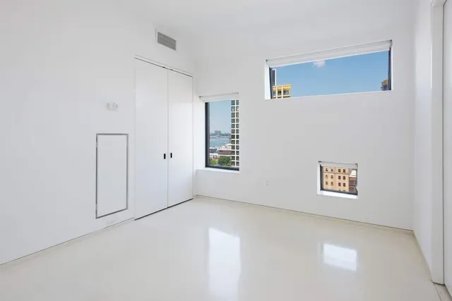 a view of an empty room with a window